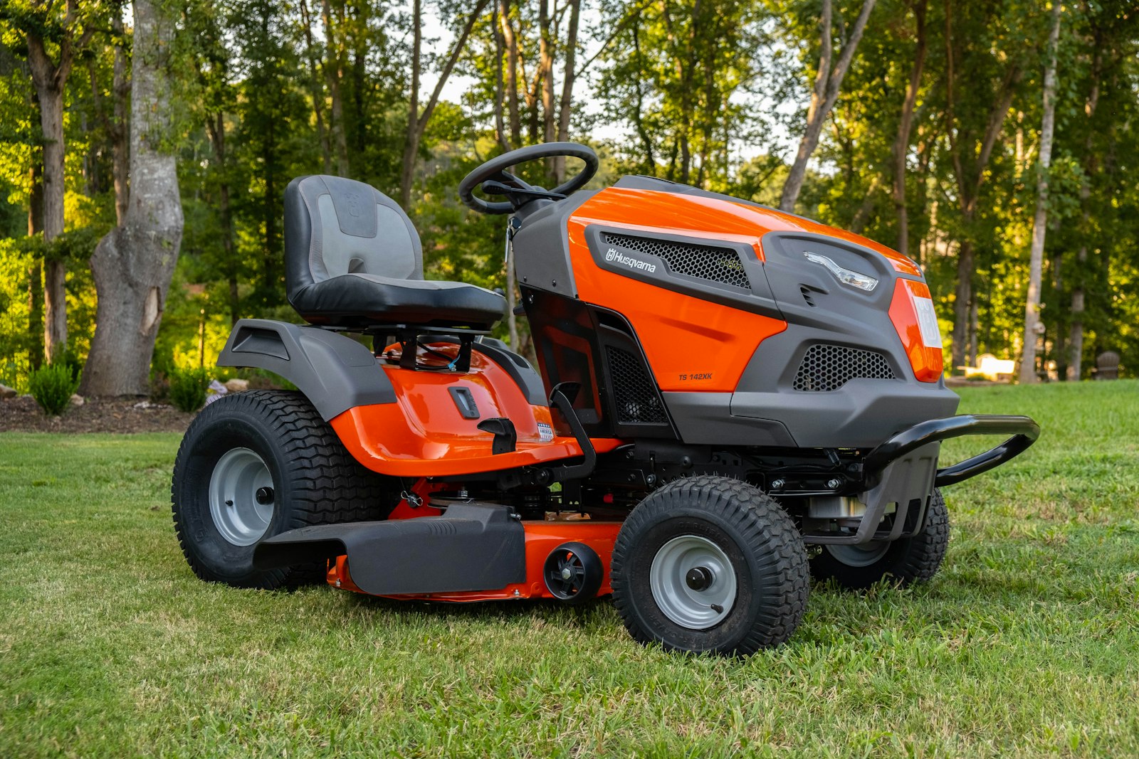 Pro-grade zero-turn mower at rest on a freshly cut lawn.
